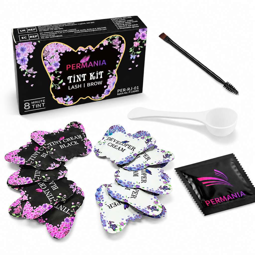 PERMANIA black lash and brow tint kit with product box, five tint cream sachets, five developer sachets, applicator brush, mixing spoon and eye pads on a white background.