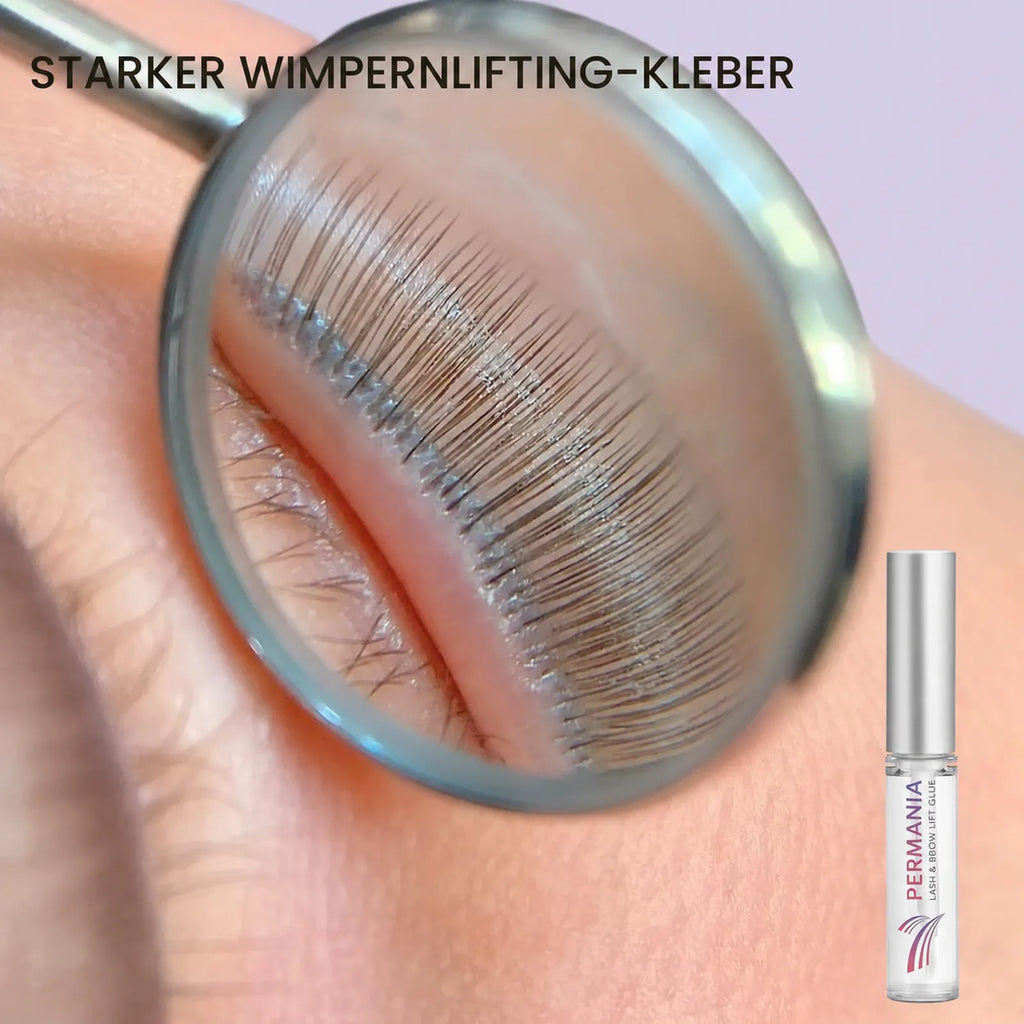 Magnified close-up of eyelashes held evenly on a silicone shield with PERMANIA lash lift glue.