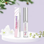 PERMANIA lash and brow lift glue bottle and matching box displayed on a pale purple platform with white flowers.